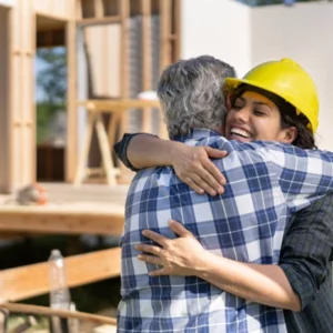Contractor hugging a man to show passionate support