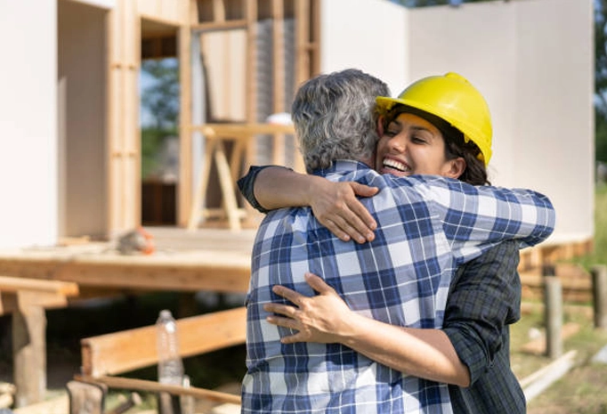 Contractor hugging a man to show passionate support
